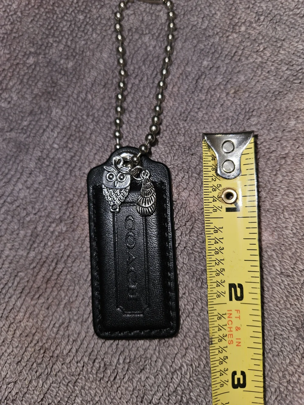 COACH Hangtag, Key Tag with Silver Key Charms. 25.00 Each